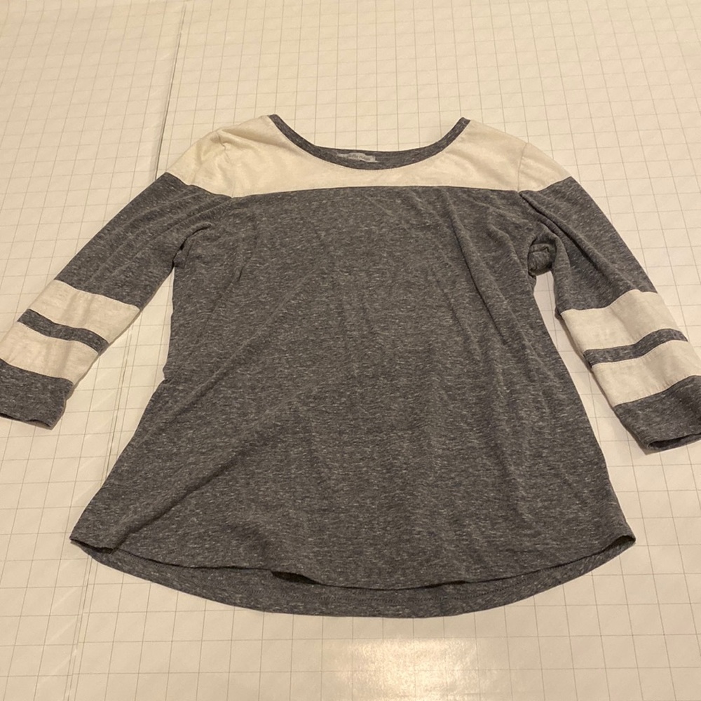 Grey and white half-sleeve with minimal detailing.